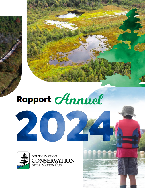 A person in a yellow suit planting a treeDescription automatically generated